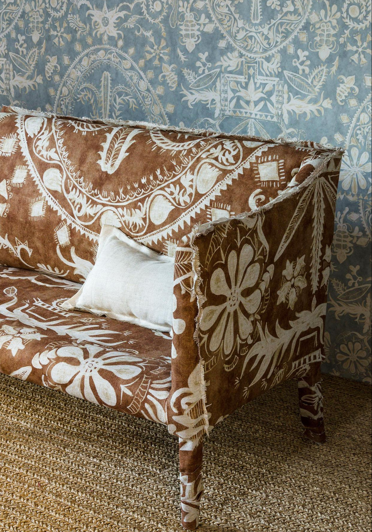 Womad sofa and wallpaper in room, lewis and wood
